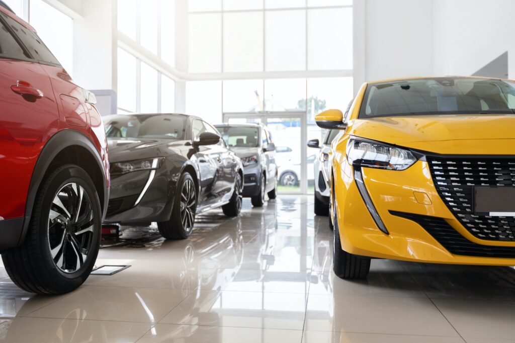 Beautiful modern cars at luxury dealership salon
